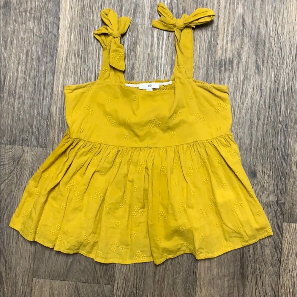 Mustard yellow crop top.